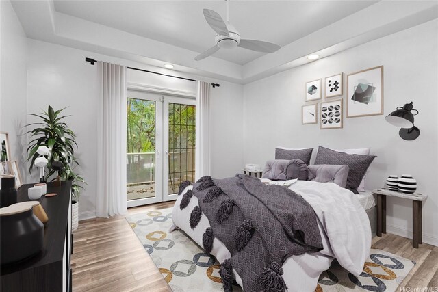 92-1277 Hauone St, Kapolei, HI 96707 - bedroom featuring access to exterior, light wood finished floors, a raised ceiling, recessed lighting, and ceiling fan