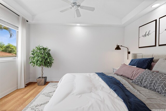 92-1277 Hauone St, Kapolei, HI 96707 - bedroom with lofted ceiling, light wood-style flooring, recessed lighting, a ceiling fan, and a tray ceiling