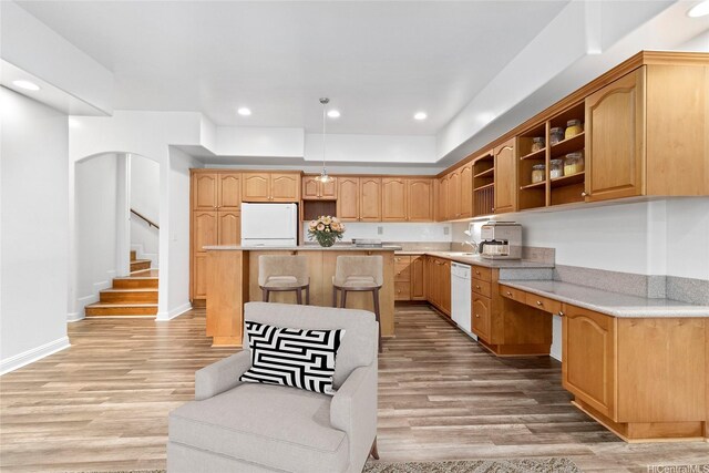 92-1277 Hauone St, Kapolei, HI 96707 - kitchen with refrigerator, dishwasher, a kitchen island, open shelves, and light wood-style flooring