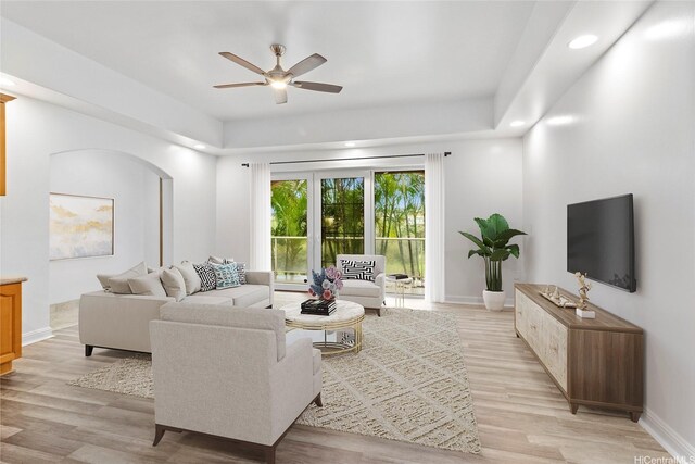 92-1277 Hauone St, Kapolei, HI 96707 - living room featuring ceiling fan, light wood-style floors, recessed lighting, and arched walkways