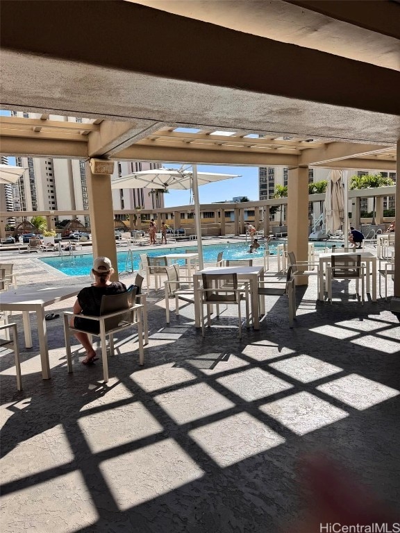 view of patio with a community pool