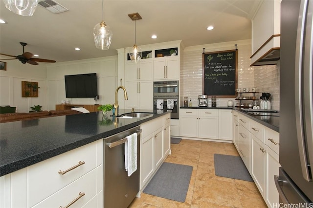 kitchen with a sink, visible vents, black appliances, tasteful backsplash, and crown molding