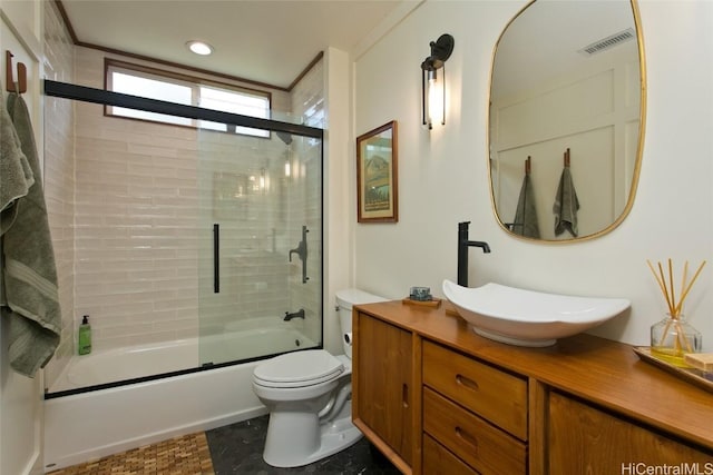 bathroom with visible vents, toilet, combined bath / shower with glass door, vanity, and recessed lighting