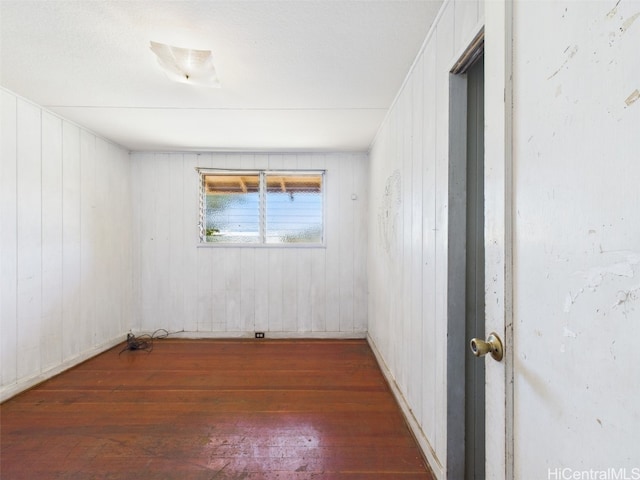 empty room featuring hardwood / wood-style flooring