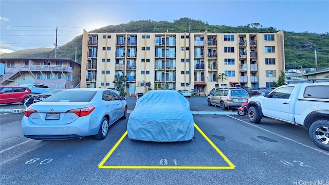 view of property featuring uncovered parking