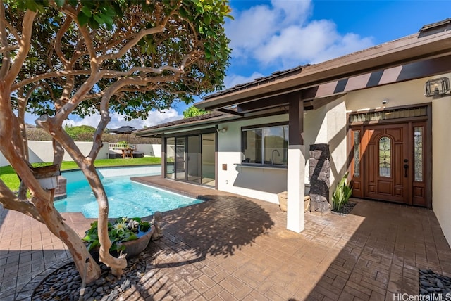 view of pool featuring a fenced in pool and a patio