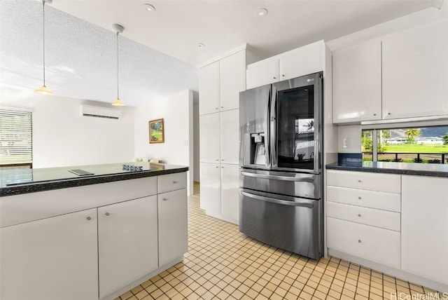 kitchen with dark countertops, white cabinetry, stainless steel refrigerator with ice dispenser, and a wall mounted AC