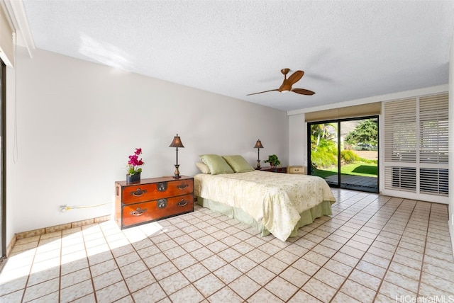 bedroom with a textured ceiling, ceiling fan, light tile patterned flooring, and access to exterior