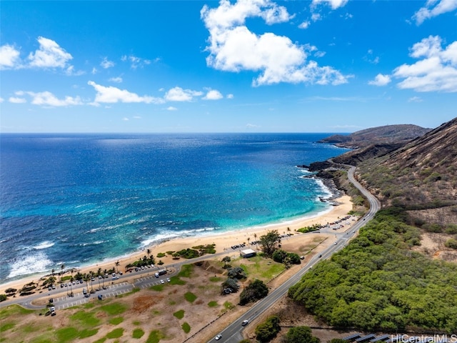 aerial view with a water view and a beach view