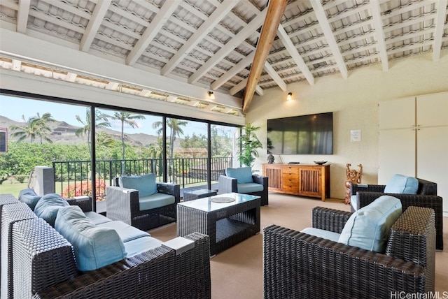 sunroom / solarium featuring vaulted ceiling with beams and wood ceiling