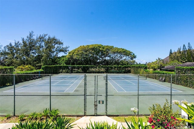 view of tennis court with fence