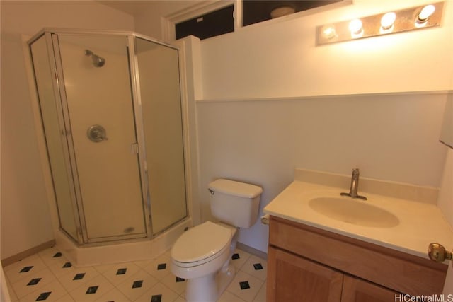 bathroom with toilet, a stall shower, tile patterned flooring, and vanity