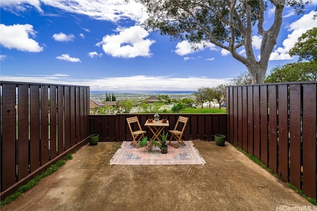 view of patio / terrace featuring fence