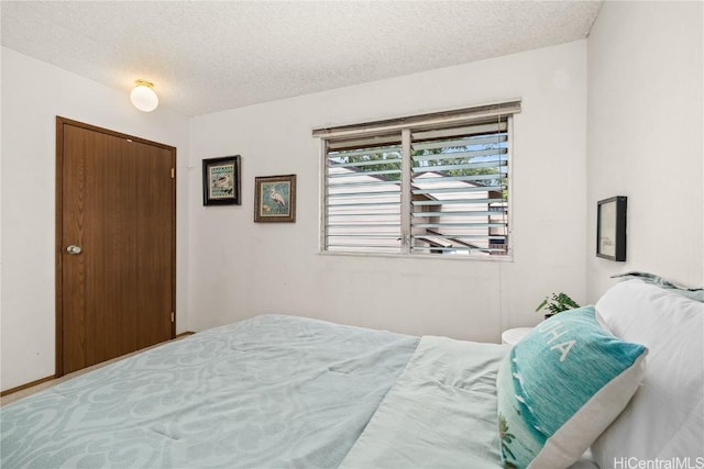 bedroom featuring a textured ceiling