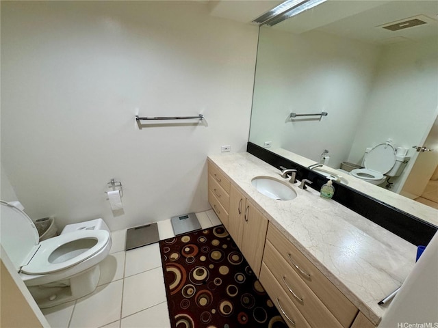 88 Piikoi St Unit 1802, Honolulu, HI 96814 - bathroom featuring toilet, vanity, and tile patterned flooring
