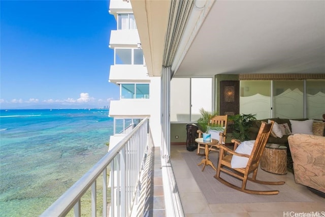 balcony featuring a water view