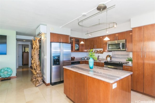 kitchen featuring brown cabinetry, a kitchen island, glass insert cabinets, decorative light fixtures, and stainless steel appliances