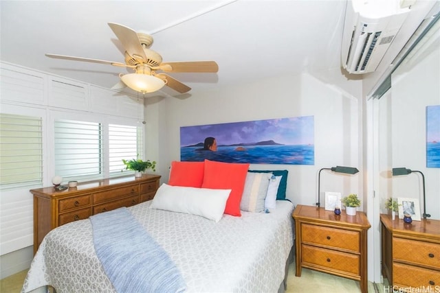 bedroom with a wall mounted AC and a ceiling fan