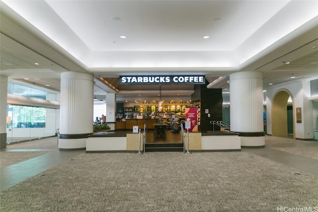 reception area featuring arched walkways and ornate columns