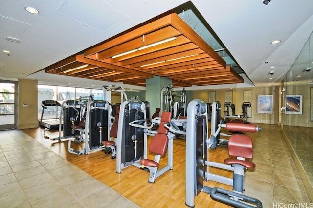 workout area with wood finished floors