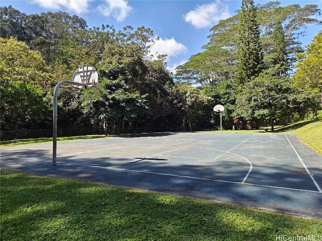 view of sport court with a yard and community basketball court