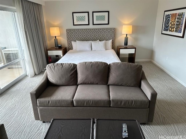 bedroom with carpet floors and baseboards