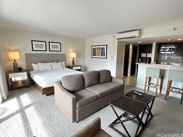 bedroom with baseboards and a wall mounted AC