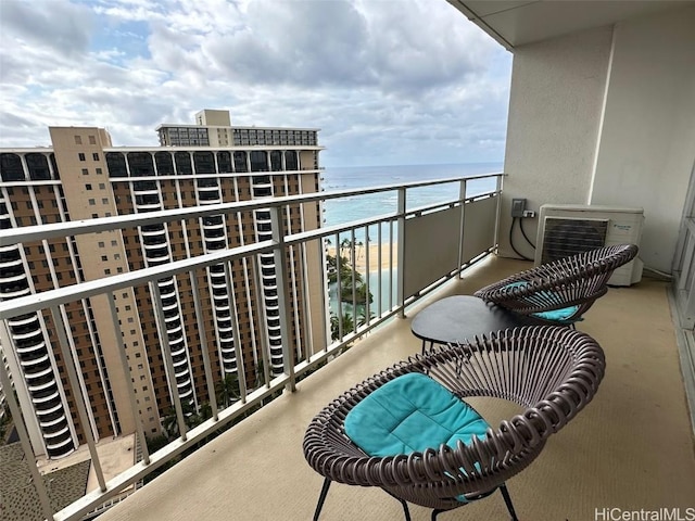 balcony with ac unit and a water view