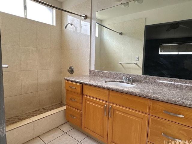 full bathroom with tile patterned flooring, vanity, and a shower stall
