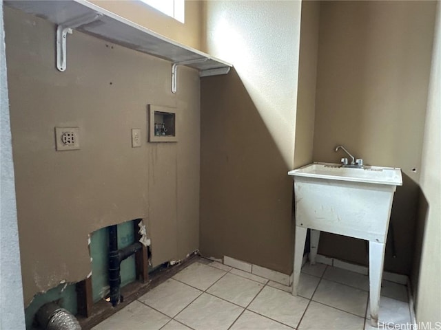 washroom with light tile patterned floors, laundry area, and hookup for a washing machine