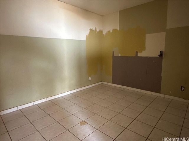 empty room with light tile patterned floors