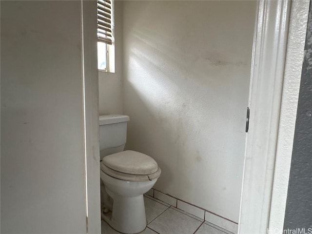 bathroom featuring toilet and tile patterned floors