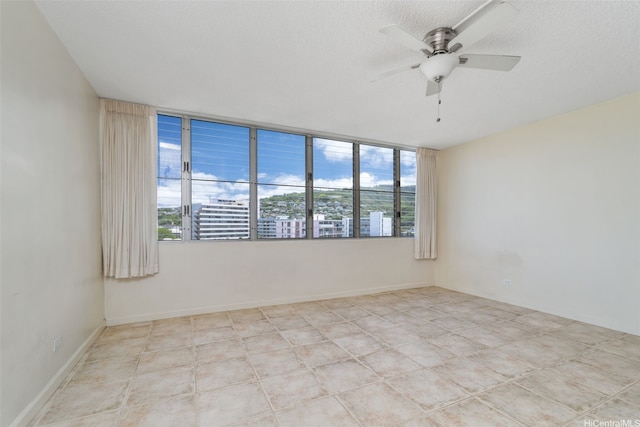 1550 Wilder Ave Unit A804, Honolulu, HI 96822 - empty room with ceiling fan and a textured ceiling