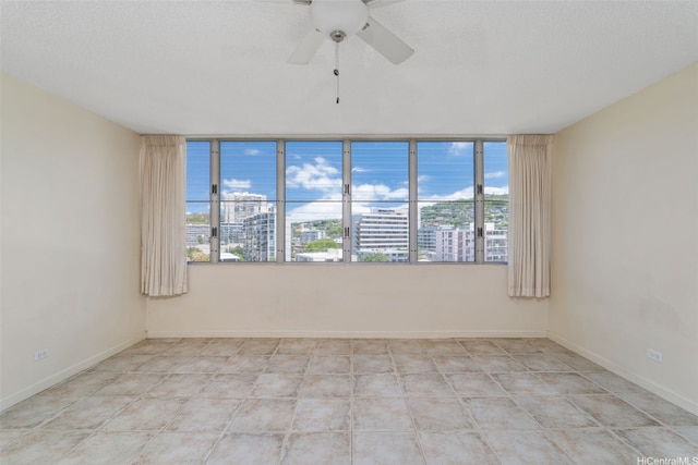 1550 Wilder Ave Unit A804, Honolulu, HI 96822 - empty room featuring a ceiling fan and a view of city