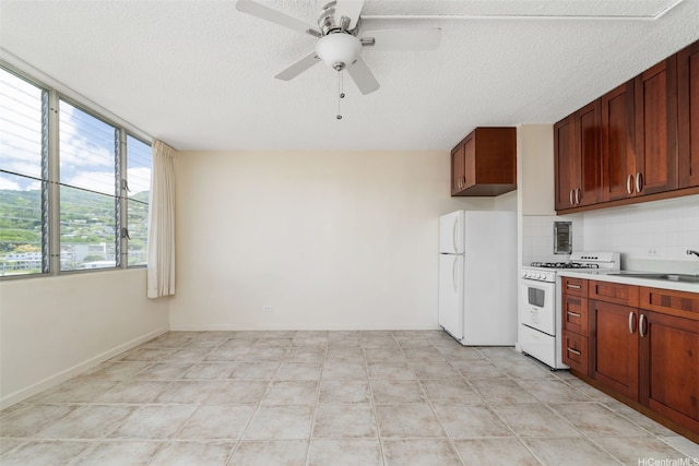 1550 Wilder Ave Unit A804, Honolulu, HI 96822 - kitchen featuring white appliances, a sink, light countertops, a ceiling fan, and backsplash