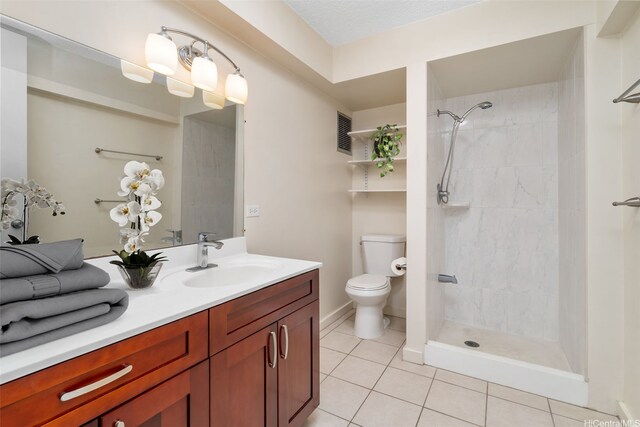 1550 Wilder Ave Unit A804, Honolulu, HI 96822 - full bathroom featuring tile patterned flooring, toilet, tiled shower, and vanity