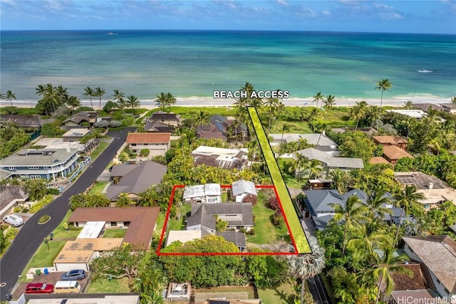 drone / aerial view featuring a beach view, a water view, and a residential view