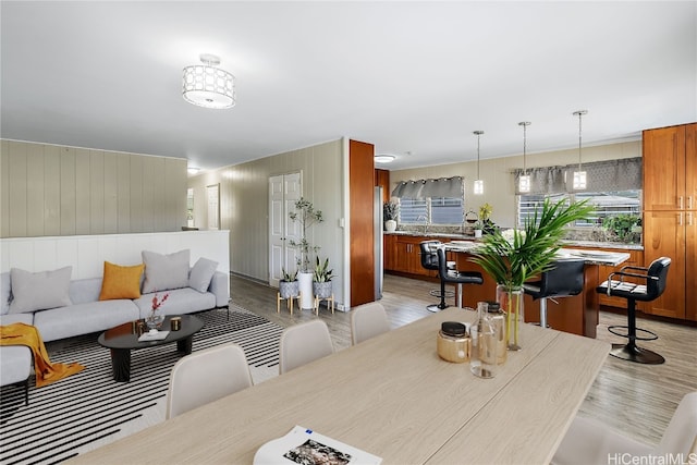 dining area featuring light wood-style flooring