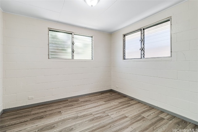 empty room with wood finished floors