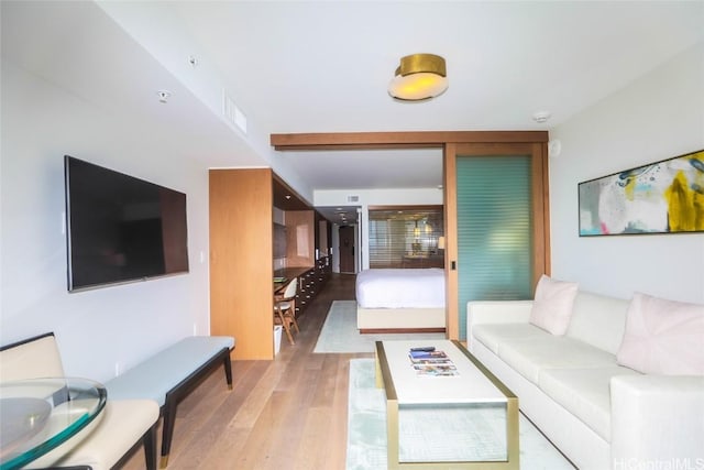 2139 Kuhio Ave Unit 1207, Honolulu, HI 96815 - living room featuring wood finished floors