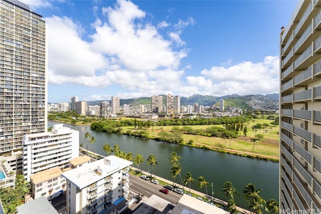 view of water feature with a mountain view and a city view