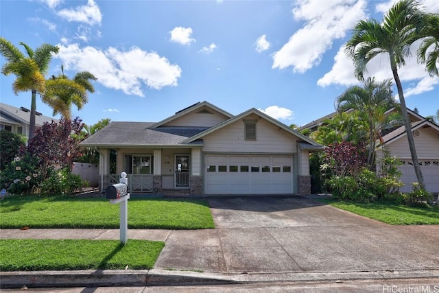 view of front facade featuring an attached garage, driveway, a porch, and a front yard