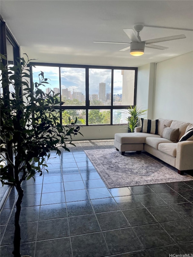 3138 Waialae Ave Unit 418, Honolulu, HI 96816 - living area with dark tile patterned floors, ceiling fan, and a city view