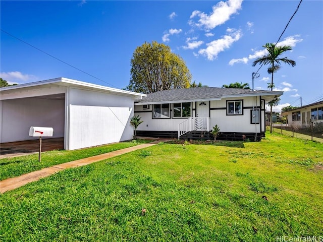 14 Hauola St, Wahiawa, HI 96786 - view of front of property with a shingled roof and a front yard