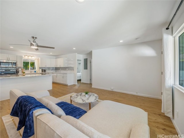 14 Hauola St, Wahiawa, HI 96786 - living room with light wood-type flooring, baseboards, and recessed lighting