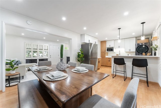 dining room featuring light wood-style floors and recessed lighting