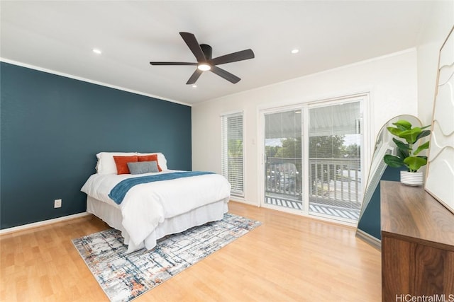 bedroom with ornamental molding, light wood-style floors, baseboards, and access to exterior