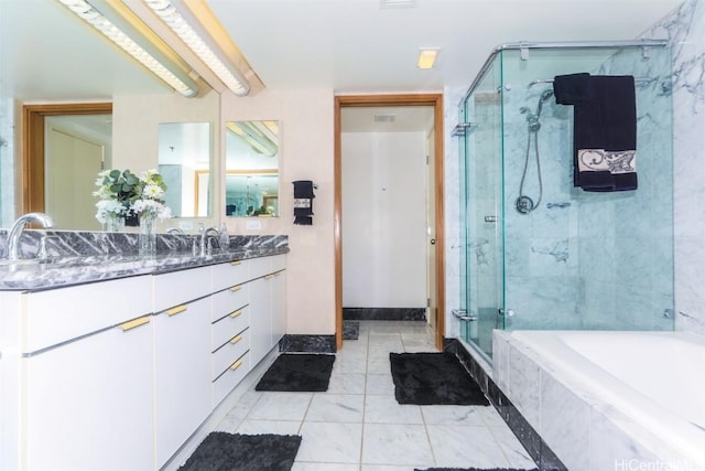 full bath with a garden tub, a sink, a shower stall, and double vanity