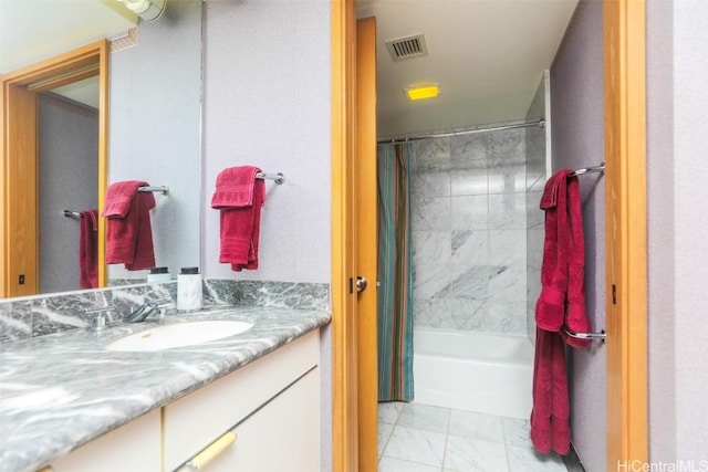 bathroom with shower / bath combo with shower curtain, vanity, and visible vents