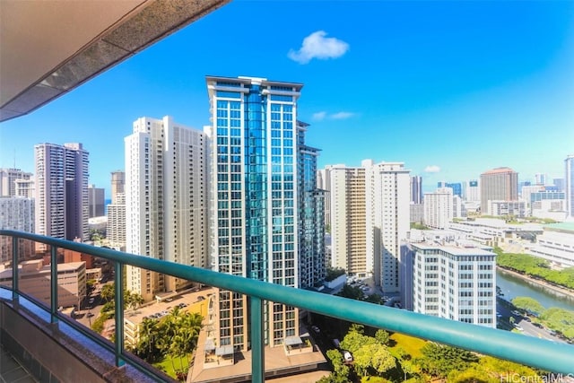 balcony with a view of city and a water view